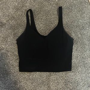Black lululemon croptop. It’s not that cropped.The size is either 3 or a 4